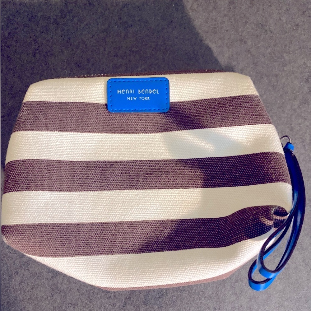 Henri Bendel blue, white and grey striped wristlet.